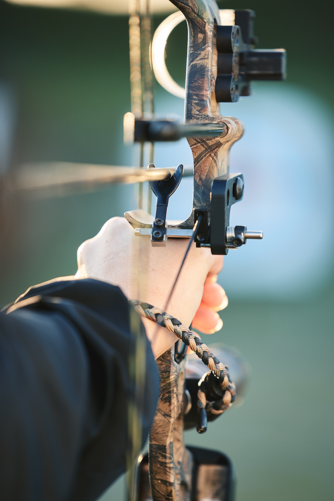 Sports archer, hands and bow and arrow training for archery competition, athlete challenge or girl